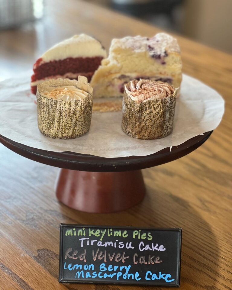 Desserts on display with handwritten sign