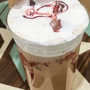 Iced coffee with whipped cream topping